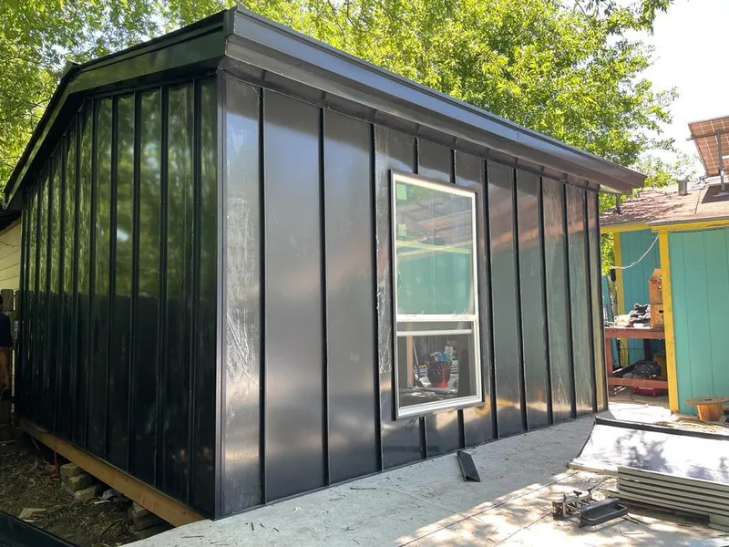 Black standing seam metal wall panels for Roof Inspection in Juneau