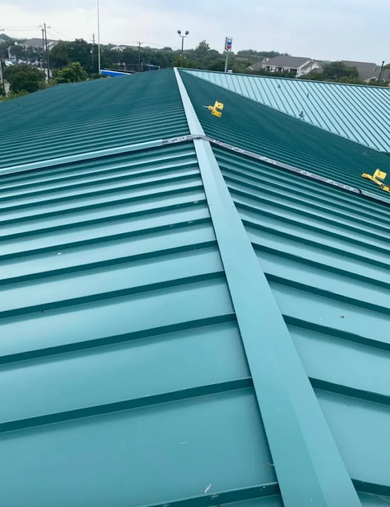 Green commercial metal roof ridge and valley for Metal Roof Repair in Juneau
